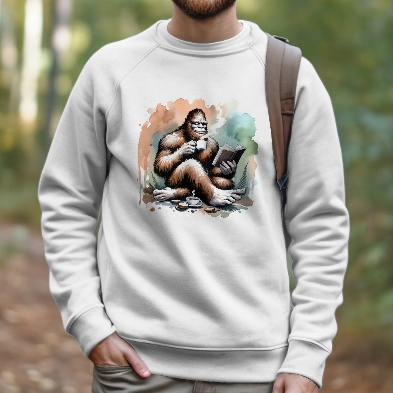 Bigfoot Reading Book T-Shirt, Cozy Sasquatch Tea Time Tee,Unique Cryptid Lovers Gift, Nature Inspired Graphic Shirt, Coffee Lover Sweatshirt